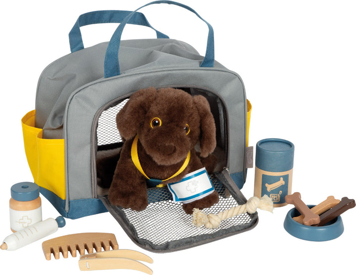 dog with bag and grooming set