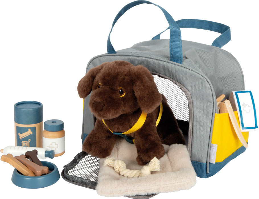 dog with bag and grooming set