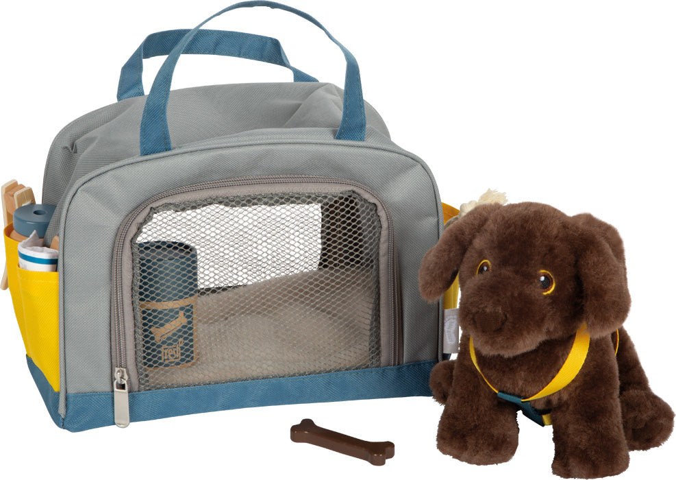 dog with bag and grooming set