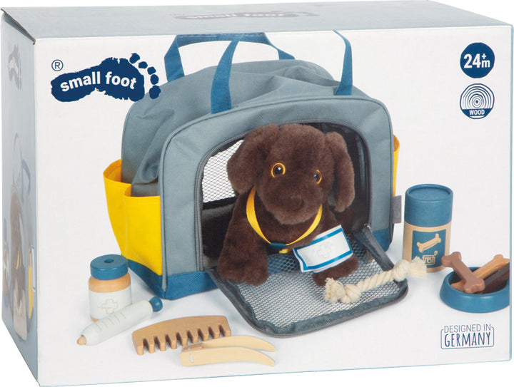 dog with bag and grooming set